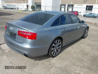 2013 Audi A6 3.0T Prestige with VIN WAUHGAFC4DN126258, listed as a IAAI auction lot 41512291 with 123,298 mi miles. Bid and sale history available at carsss.com. Image 4.