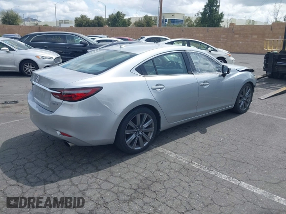 2018 Mazda 6 Grand Touring with VIN JM1GL1TY0J1306768, listed as a IAAI auction lot 41744640 with 81,798 mi miles and . Bid and sale history available at DreamBid. Image 4.