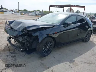 2021 Mazda 3 Premium Plus z VIN JM1BPBNY2M1403797, wystawiony jako IAAI lot #42031637 z przebiegiem Nie podano mil oraz . Historia ofert i sprzedaży dostępna na DreamBid. Obrazek 17.