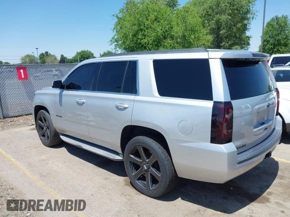 2015 Chevrolet Tahoe LT with VIN 1GNSCBKC9FR111001, listed as a IAAI auction lot 42440624 with 128,087 mi miles and . Bid and sale history available at DreamBid. Image 3.