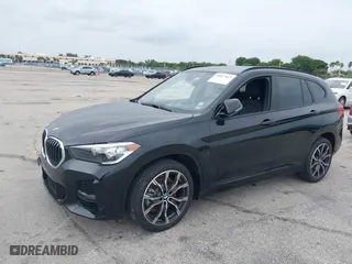 2021 BMW X1 sDrive28i with VIN WBXJG7C05M5U03116, listed as a IAAI auction lot 39837867 with 16,788 mi miles. Bid and sale history available at carsss.com. Image 2.
