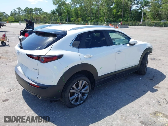 2024 Mazda CX-30 S Carbon Edition with VIN 3MVDMBCM2RM719131, listed as a IAAI auction lot 42265739 with 8,470 mi miles and . Bid and sale history available at DreamBid. Image 4.