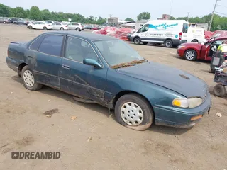 1996 Toyota Camry DX z VIN 4T1BG12K4TU724923, wystawiony jako IAAI lot #42412756 z przebiegiem 273 142 mil mil oraz . Historia ofert i sprzedaży dostępna na DreamBid. Obrazek 1.