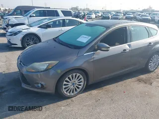 2012 Ford Focus Titanium with VIN 1FAHP3N22CL200249, listed as a IAAI auction lot 42149873 with 103,805 mi miles and . Bid and sale history available at carsss.com. Image 2.