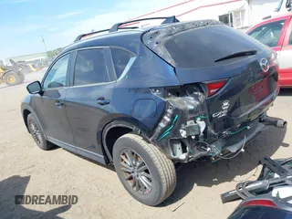 2017 Mazda CX-5 Touring z VIN JM3KFBCL5H0133493, wystawiony jako IAAI lot #39666644 z przebiegiem 125 048 mil mil oraz . Historia ofert i sprzedaży dostępna na DreamBid. Obrazek 3.