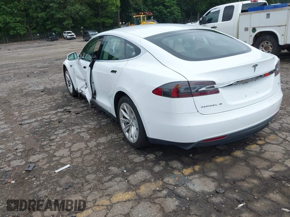 2016 Tesla Model S 70 with VIN 5YJSA1E11GF132984, listed as a IAAI auction lot 42428634 with Not provided miles and . Bid and sale history available at DreamBid. Image 3.