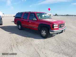 1999 GMC Suburban with VIN 1GKFK16RXXJ809823, listed as a IAAI auction lot 41687406 with 360,799 mi miles. Bid and sale history available at carsss.com. Image 1.