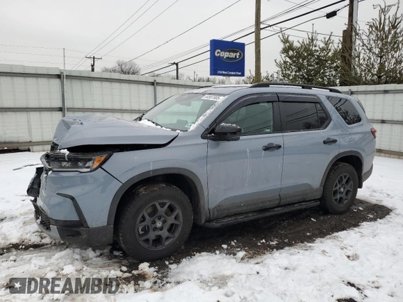 2025 Honda Pilot TrailSport with VIN 5FNYG1H69SB003433, listed as a Copart auction lot 44587005 with 16,854 mi miles and Salvage Title. Bid and sale history available at carsss.com. Image 1.