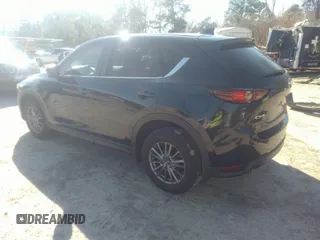 2020 Mazda CX-5 Touring with VIN JM3KFACM1L1817303, listed as a IAAI auction lot 41627859 with 57,268 mi miles. Bid and sale history available at carsss.com. Image 3.