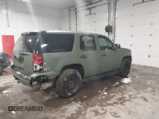 2014 Chevrolet Tahoe Commercial with VIN 1GNSK2E05ER196941, listed as a IAAI auction lot 41938892 with 176,170 mi miles and . Bid and sale history available at DreamBid. Image 4.