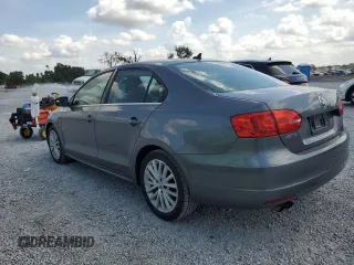 2014 Volkswagen Jetta TDI w/Premium with VIN 3VWLL7AJ7EM436916, listed as a Copart auction lot 58238385 with 103,265 mi miles and Salvage title. Bid and sale history available at DreamBid. Image 2.