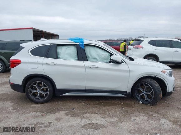 2019 BMW X1 xDrive28i with VIN WBXHT3C51K5L90392, listed as a IAAI auction lot 41571403 with 96,732 mi miles. Bid and sale history available at carsss.com. Image 13.