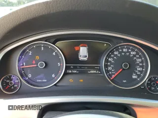 2015 Volkswagen Touareg Lux с VIN WVGEP9BP4FD004212, выставлен на аукционе Copart как лот 54021345 с пробегом 156 164 миль миль и Списание • Salvage title. История ставок и продаж доступна на DreamBid. Изображение 9.