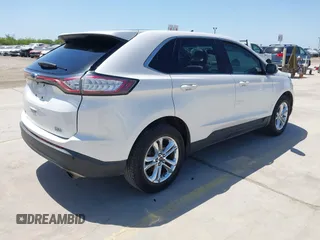 2015 Ford Edge SEL with VIN 2FMTK3J97FBC16209, listed as a IAAI auction lot 41974393 with 129,608 mi miles. Bid and sale history available at carsss.com. Image 4.