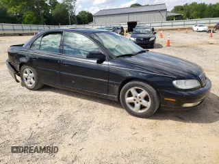 2000 Cadillac Catera z VIN W06VR54R0YR011736, wystawiony jako Copart lot #54927395 z przebiegiem 45 892 mil mil oraz Szkoda całkowita • Salvage title. Historia ofert i sprzedaży dostępna na DreamBid. Obrazek 4.