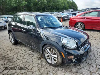 2014 MINI Countryman S with VIN WMWZC3C56EWP25479, listed as a Copart auction lot 61197525 with 101,146 mi miles and Salvage title. Bid and sale history available at DreamBid. Image 4.