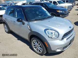2015 MINI Cooper Countryman S with VIN WMWZC3C51FWT06084, listed as a IAAI auction lot 41949558 with 102657 miles. Bid and sale history available at carsss.com. Image 1.