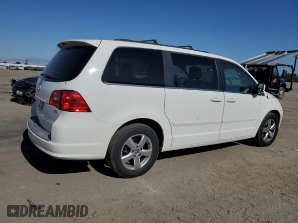 2011 Volkswagen Routan SE with VIN 2V4RW3DG5BR739944, listed as a Copart auction lot 56787495 with 84,932 mi miles and Salvage title. Bid and sale history available at DreamBid. Image 3.