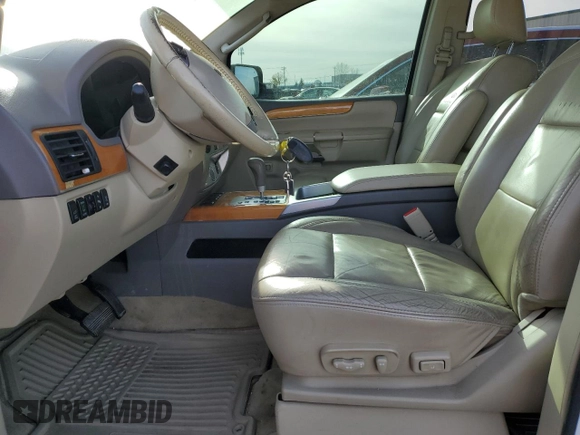 2009 Infiniti QX56 with VIN 5N3AA08C59N901495, listed as a Copart auction lot 78002924 with 127,879 mi miles and Salvage Title. Bid and sale history available at carsss.com. Image 7.