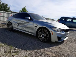 2015 BMW M4 with VIN WBS3R9C58FK334216, listed as a Copart auction lot 61497804 with 112,191 mi miles and Salvage Title. Bid and sale history available at carsss.com. Image 4.