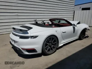 2021 Porsche 911 Turbo S with VIN WP0CD2A96MS263310, listed as a Copart auction lot 65493254 with 4,904 mi miles and Salvage Title. Bid and sale history available at carsss.com. Image 3.