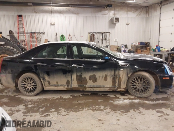 2010 Cadillac STS AWD with VIN 1G6DU6EV2A0125065, listed as a IAAI auction lot 41229886 with 84,954 mi miles and . Bid and sale history available at DreamBid. Image 14.