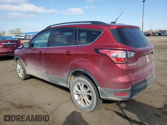 2018 Ford Escape SE z VIN 1FMCU9GD0JUC29279, wystawiony jako Copart lot #54511595 z przebiegiem 77 547 mil mil oraz Czysty tytuł • Clean title. Historia ofert i sprzedaży dostępna na DreamBid. Obrazek 2.