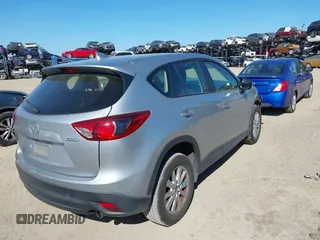 2016 Mazda CX-5 Sport with VIN JM3KE2BE9G0915168, listed as a IAAI auction lot 41482749 with 86,802 mi miles and . Bid and sale history available at carsss.com. Image 4.