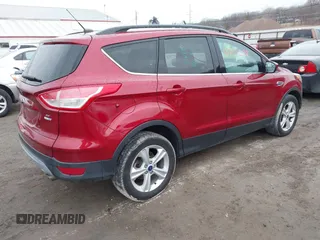 2014 Ford Escape SE with VIN 1FMCU9GX7EUC35483, listed as a IAAI auction lot 41704298 with 105,017 mi miles. Bid and sale history available at carsss.com. Image 4.