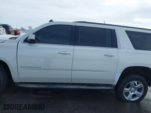 2015 Chevrolet Suburban LT with VIN 1GNSKJKC0FR309866, listed as a IAAI auction lot 41743848 with 220,778 mi miles and . Bid and sale history available at DreamBid. Image 14.