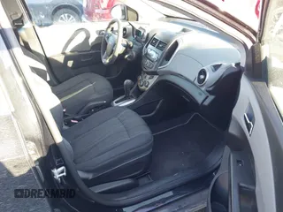 2013 Chevrolet Sonic LT with VIN 1G1JC6SB2D4256838, listed as a IAAI auction lot 41443769 with 98,839 mi miles. Bid and sale history available at carsss.com. Image 5.