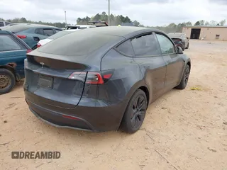 2024 Tesla Model Y with VIN 7SAYGDED3RA303113, listed as a IAAI auction lot 41915760 with 12,917 mi miles and . Bid and sale history available at DreamBid. Image 4.