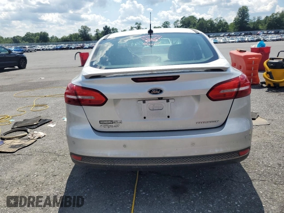 2015 Ford Focus Titanium with VIN 1FADP3J27FL267339, listed as a Copart auction lot 63395835 with 73,372 mi miles and Salvage title. Bid and sale history available at DreamBid. Image 6.