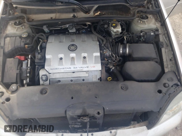 2003 Cadillac DeVille DTS z VIN 1G6KF57973U163124, wystawiony jako Copart lot #78054584 z przebiegiem 111 189 mil mil oraz Szkoda całkowita • Salvage title. Historia ofert i sprzedaży dostępna na DreamBid. Obrazek 11.