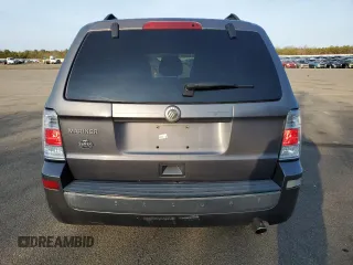 2010 Mercury Mariner z VIN 4M2CN9B70AKJ28137, wystawiony jako Copart lot #48926345 z przebiegiem 100 975 mil mil oraz Szkody całkowita. Historia ofert i sprzedaży dostępna na DreamBid. Obrazek 6.
