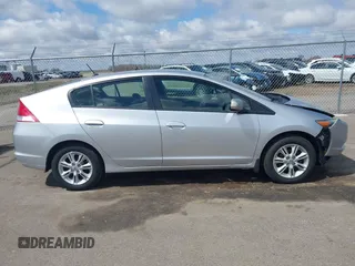 2010 Honda Insight EX with VIN JHMZE2H71AS017996, listed as a IAAI auction lot 42091356 with 142,474 mi miles and . Bid and sale history available at DreamBid. Image 13.
