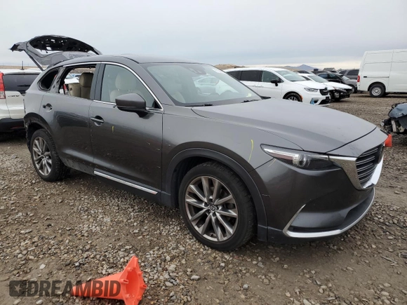 2017 Mazda CX-9 Grand Touring with VIN JM3TCBDYXH0143217, listed as a Copart auction lot 81388264 with 130,381 mi miles and Salvage Title. Bid and sale history available at carsss.com. Image 4.
