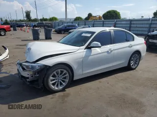 2018 BMW 3 Series 320i xDrive with VIN WBA8A3C55JA357532, listed as a Copart auction lot 57561015 with 46,876 mi miles and Salvage title. Bid and sale history available at DreamBid. Image 1.