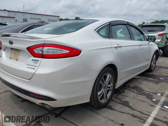 2016 Ford Fusion Titanium Hybrid with VIN 3FA6P0RU3GR190355, listed as a IAAI auction lot 42384309 with 157,172 mi miles and . Bid and sale history available at DreamBid. Image 4.