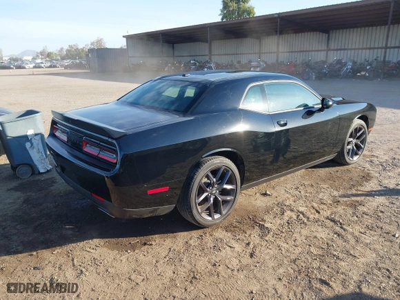 2023 Dodge Challenger SXT with VIN 2C3CDZAG0PH597128, listed as a IAAI auction lot 40865123 with 9,362 mi miles. Bid and sale history available at carsss.com. Image 4.