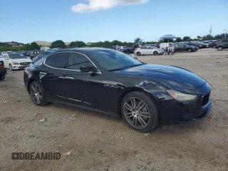 2015 Maserati Ghibli with VIN ZAM57XSA2F1129792, listed as a Copart auction lot 70717393 with 116,851 mi miles. Bid and sale history available at carsss.com. Image 4.