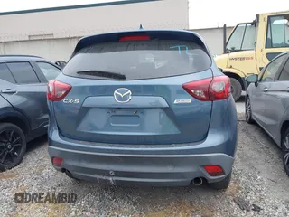 2016 Mazda CX-5 Touring z VIN JM3KE2CY2G0699138, wystawiony jako IAAI lot #42153228 z przebiegiem 144 191 mil mil oraz . Historia ofert i sprzedaży dostępna na DreamBid. Obrazek 16.