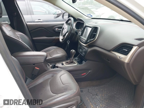 2015 Jeep Cherokee Trailhawk with VIN 1C4PJMBS9FW623740, listed as a IAAI auction lot 42131019 with 155,105 mi miles and . Bid and sale history available at DreamBid. Image 5.