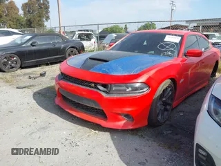 2020 Dodge Charger Scat Pack z VIN 2C3CDXGJ1LH221572, wystawiony jako IAAI lot #41286078 z przebiegiem 67 514 mil mil oraz . Historia ofert i sprzedaży dostępna na DreamBid. Obrazek 2.