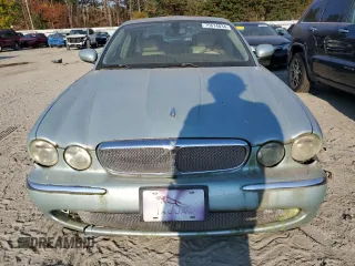 2005 Jaguar XJ with VIN SAJWA79C15SG48962, listed as a Copart auction lot 75674034 with 0 mi miles and Salvage Title. Bid and sale history available at carsss.com. Image 5.