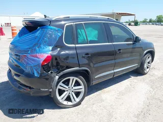 2014 Volkswagen Tiguan SEL with VIN WVGAV3AX4EW025339, listed as a IAAI auction lot 42313665 with 96,756 mi miles and . Bid and sale history available at DreamBid. Image 4.