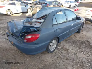 2002 Kia Rio with VIN KNADC123826128733, listed as a IAAI auction lot 41643123 with 101,433 mi miles. Bid and sale history available at carsss.com. Image 4.