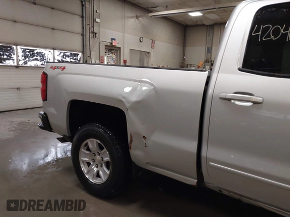 2015 Chevrolet Silverado 1500 LT with VIN 1GCVKREH5FZ271451, listed as a IAAI auction lot 42040083 with 262,135 mi miles and . Bid and sale history available at DreamBid. Image 6.