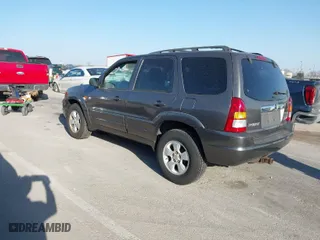 2004 Mazda Tribute LX with VIN 4F2YZ04114KM13048, listed as a IAAI auction lot 41800446 with 152,303 mi miles. Bid and sale history available at carsss.com. Image 3.