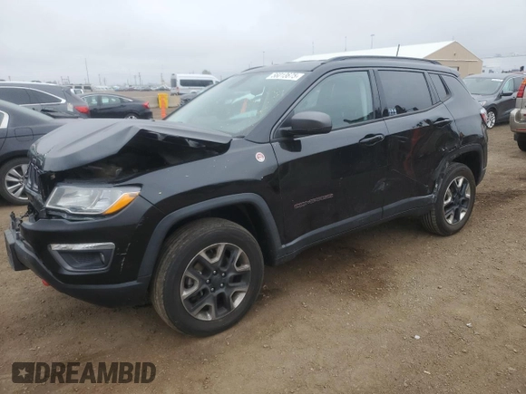 2018 Jeep Compass Trailhawk with VIN 3C4NJDDB6JT207289, listed as a Copart auction lot 56013675 with 83,385 mi miles and Salvage title. Bid and sale history available at DreamBid. Image 1.